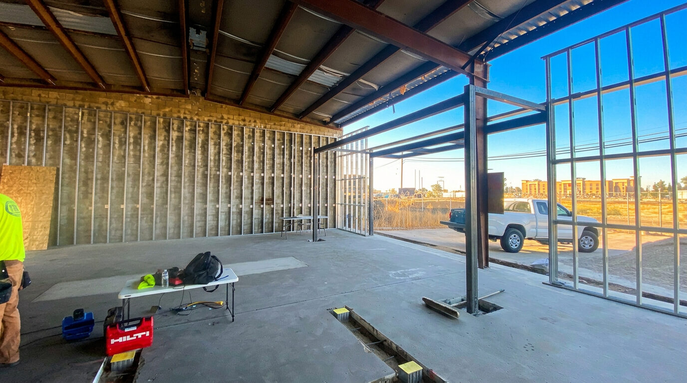Commercial construction in progress — steel framing by Drake Contracting crew