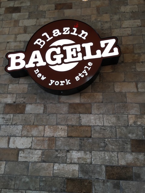 Blazin Bagelz sign on the restaurant's stone wall